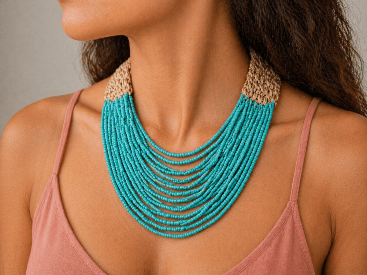 multi strand seed bead turquoise necklace worn by a model in a pink top Main image