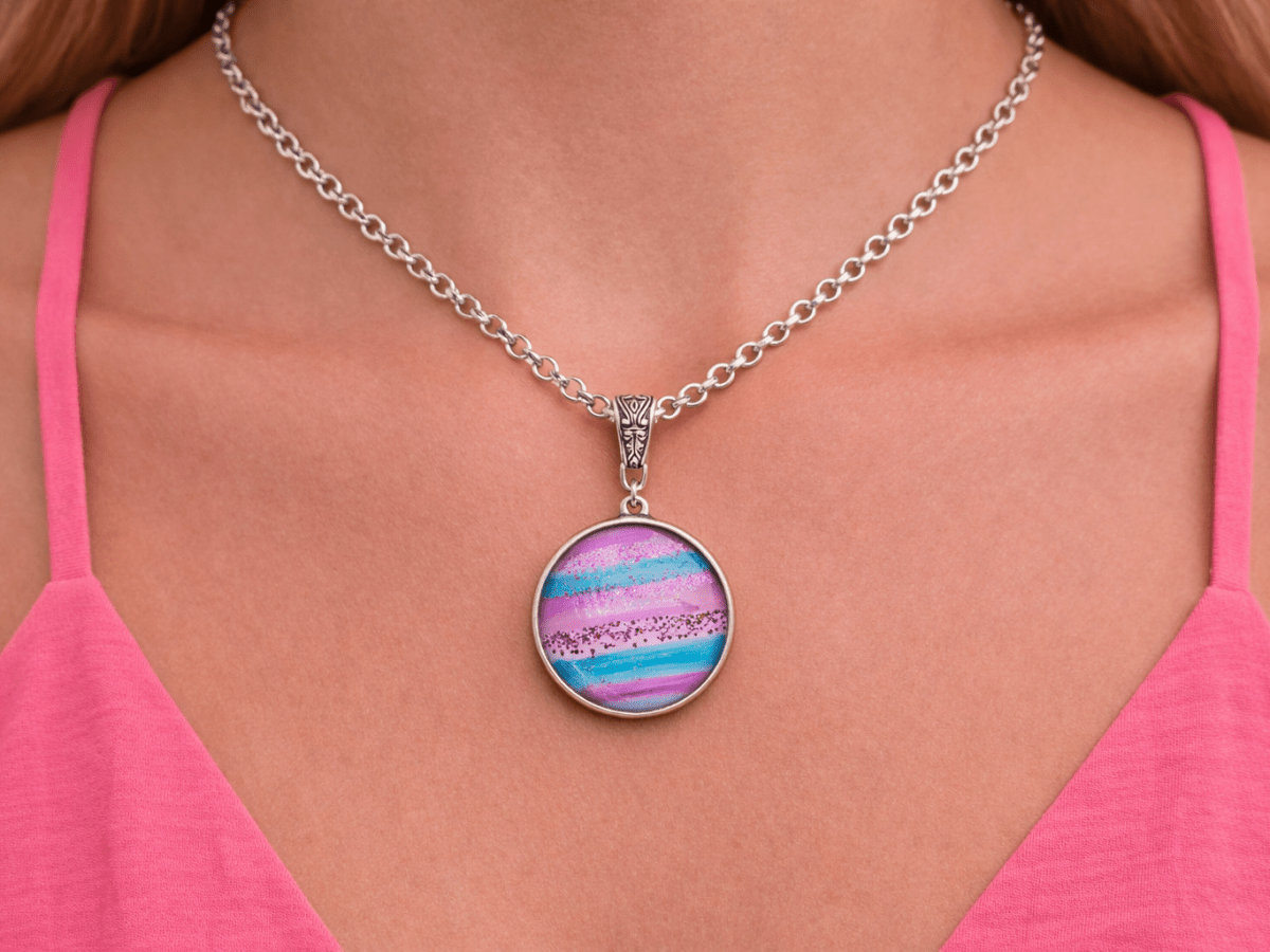 Raina pink and blue glass pendant being worn by a model - Corky & Stoner Main image