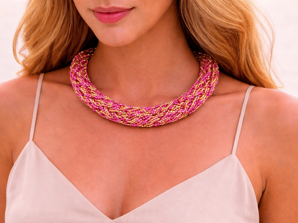 Pink and gold seed bead rope choker necklace being worn by a model in a white top Main image