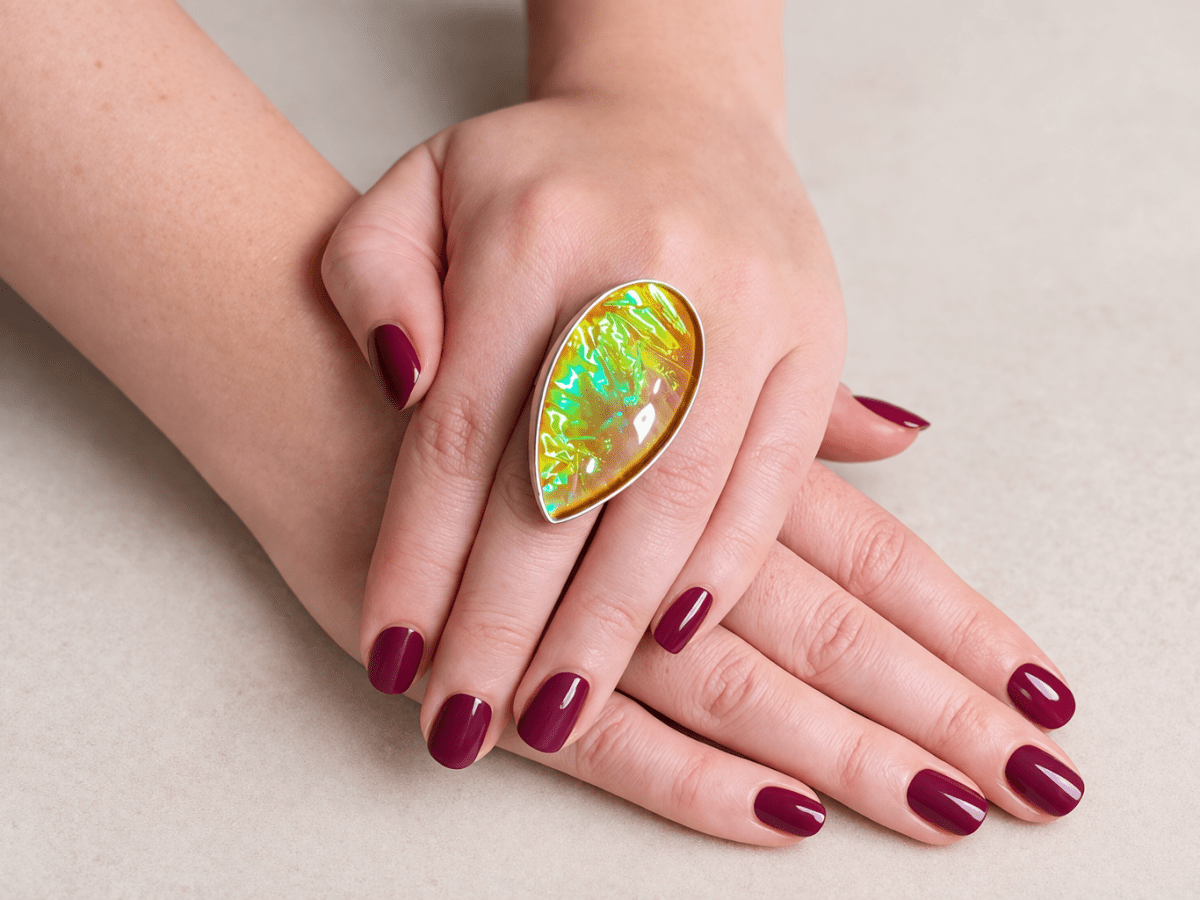 A bold Yellow Triplet Opal Ring designed to stand out. The stone glows with vibrant flashes of green and gold, shifting beautifully in the light. Set in 925 silver - Corky & Stoner