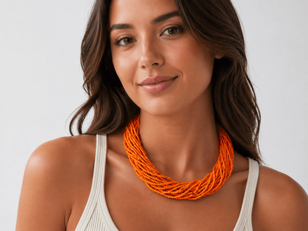 Aubree orange multi strand seed bead necklace being worn by a model - Corky & Stoner