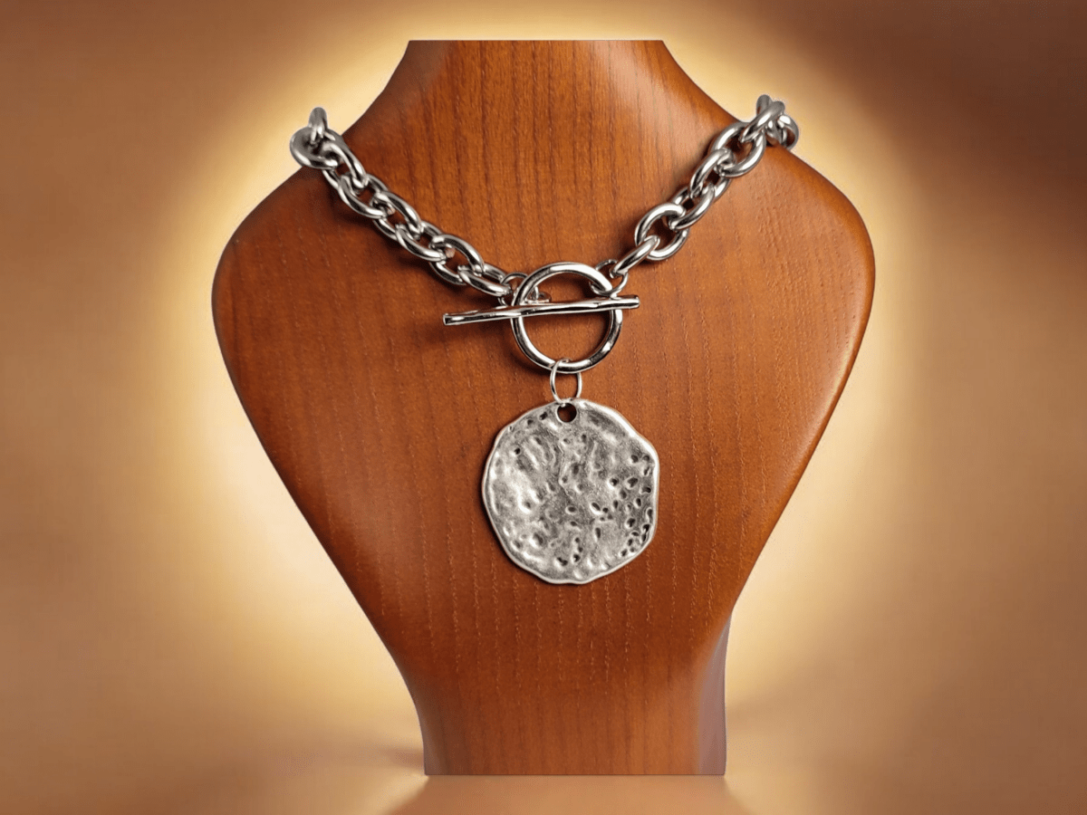 A chunky stainless steel chain necklace on a wooden bust Main image