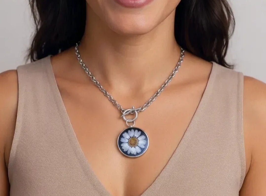 Sweet Daisy Pendant Necklace worn by a model with brown hair and a beige top Main image