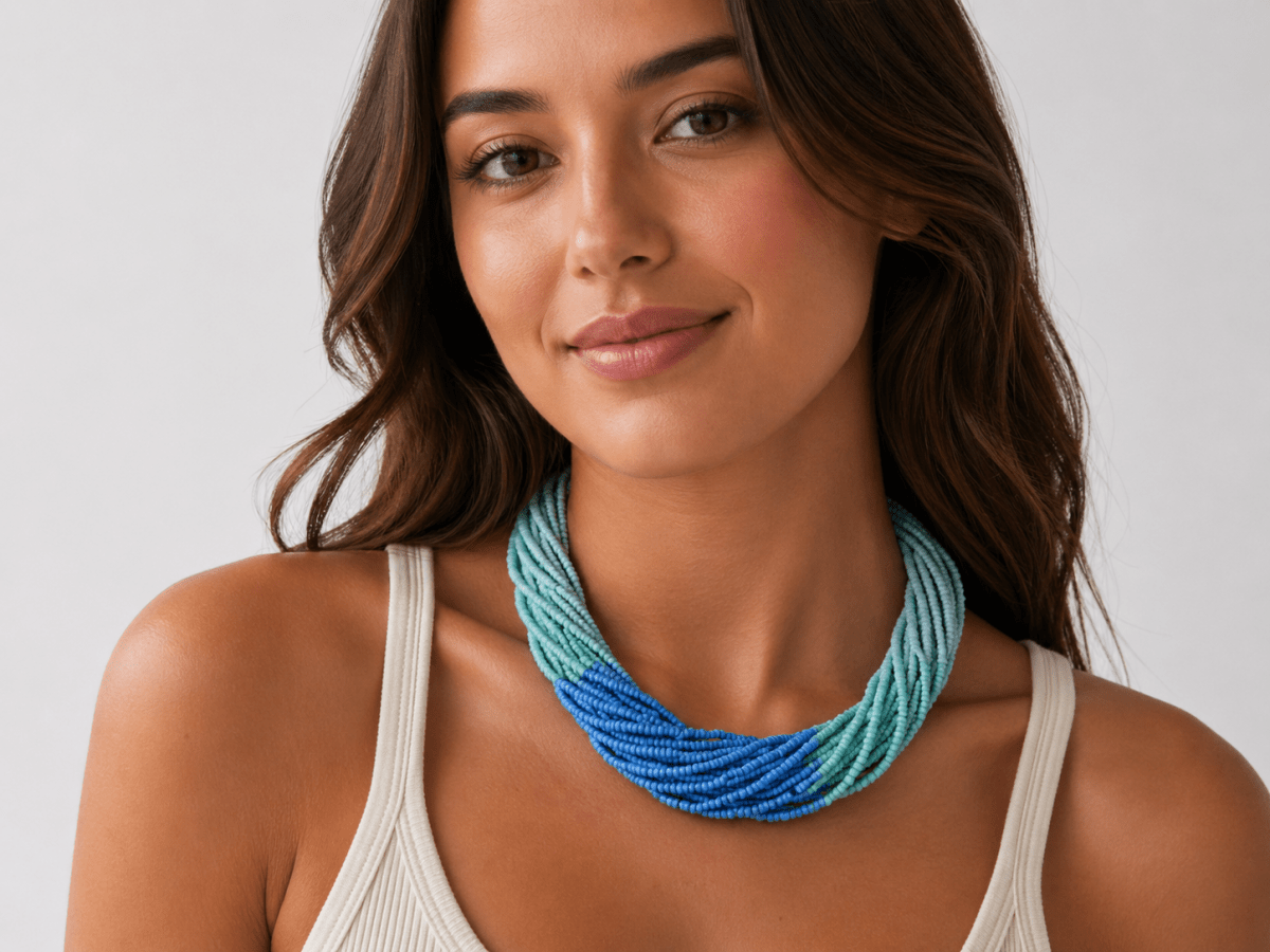 Camryn multi strand seed bead necklace in blue being worn by a model  - Corky & Stoner