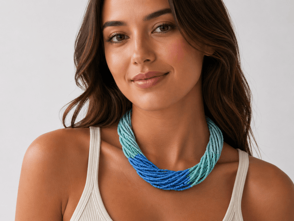 Camryn multi strand seed bead necklace in blue being worn by a model  - Corky & Stoner