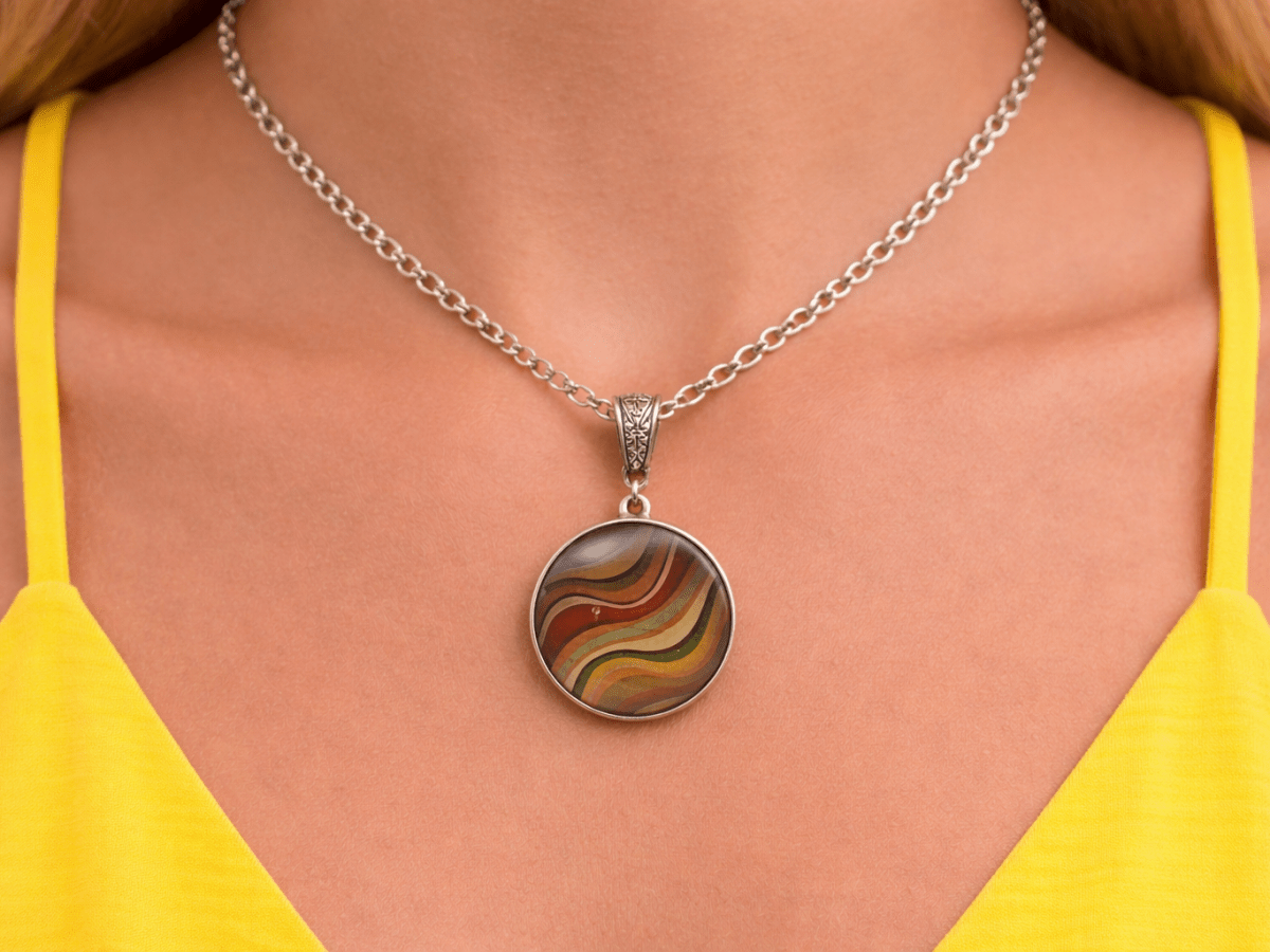 Mckinley brown glass pendant being worn by a model - Corky & Stoner Main image