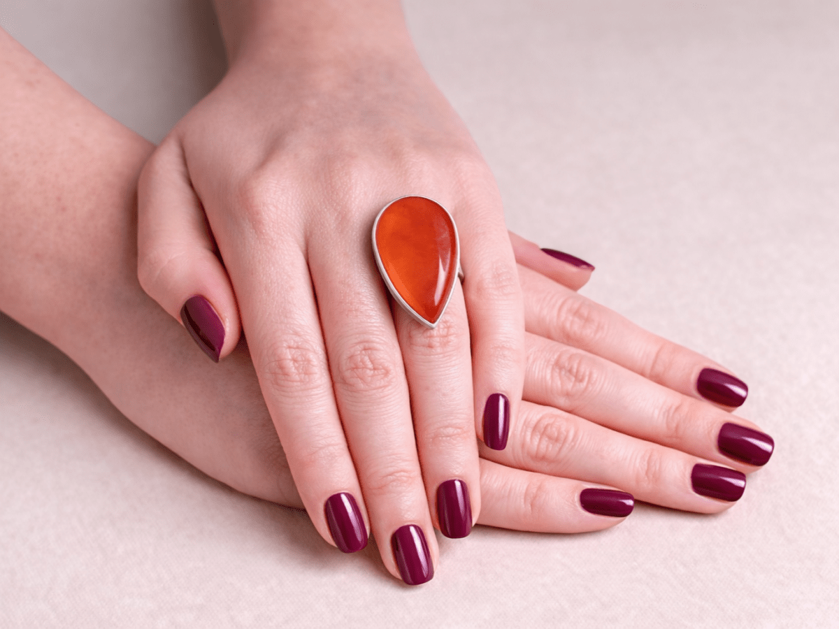 A bold carnelian ring with rich, fiery orange tones that instantly stand out. The teardrop-shaped stone has a smooth, polished finish, with natural depth in colour that catches the light beautifully - Corky & Stoner Main image