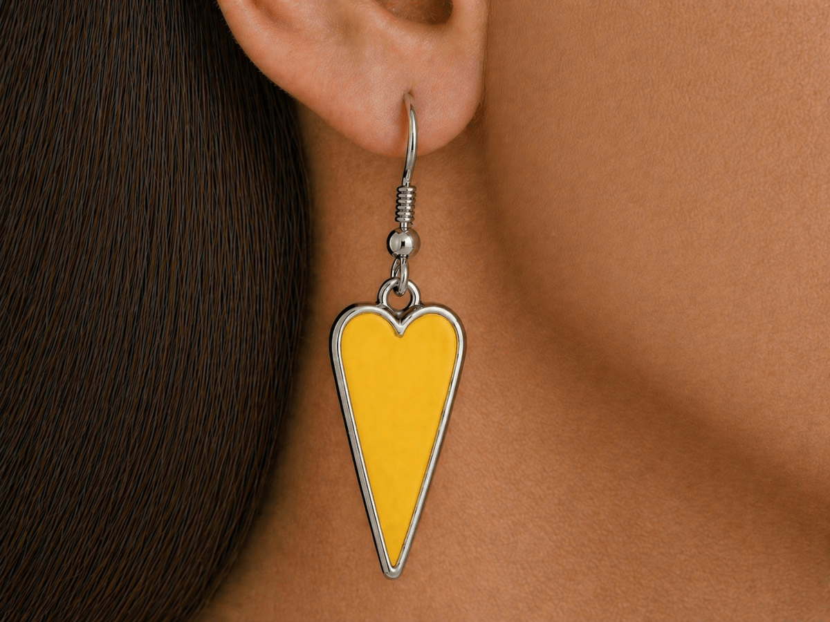 A model wearing some yellow heart shaped earrings