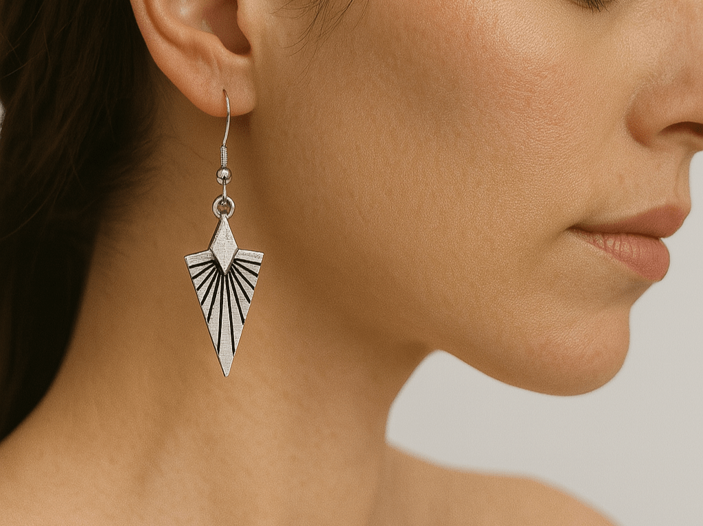 These elegant Art Deco style earrings capture the essence of 1920s glamour with their distinctive triangular design. The dangle drop style creates beautiful movement with every turn of your head - Corky & Stoner