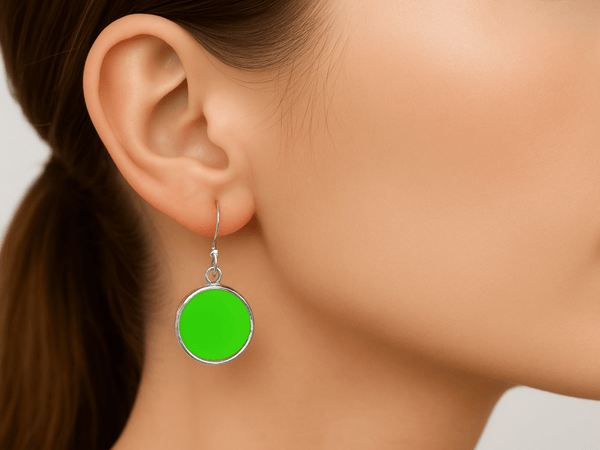 Neon green 925 silver drop earrings, 20mm round disc design. Hypoallergenic, lightweight, and handcrafted in the UK.- Corky & Stoner