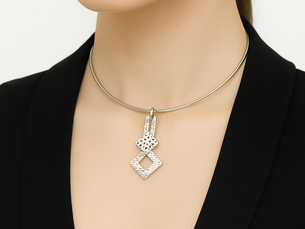 A model wearing a black top and a silver choker Main image