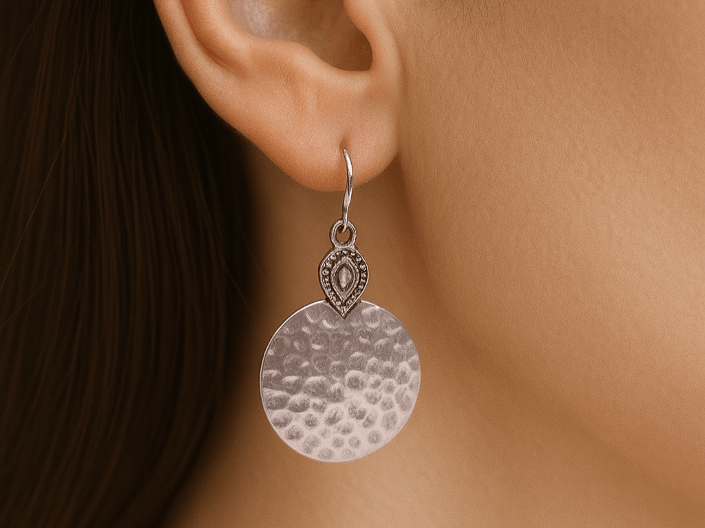 Elegant and unique hammered silver circular earrings featuring an ethnic touch -  Corky and Stoner