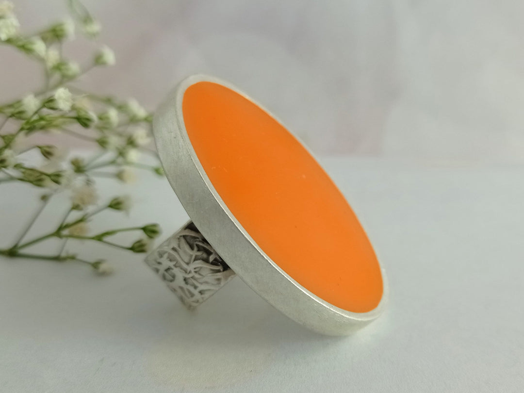 large silver oval orange cocktail ring